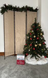 A message stating 'Coming Soon' with a small branch and leaves in the corner